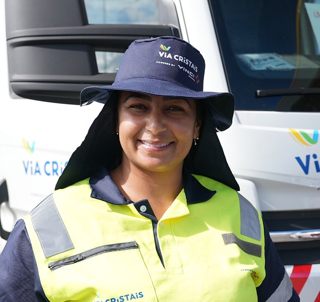A worker on the Via Cristais highway in Brazil, wearing high-visibility vest